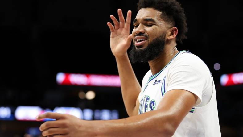 Mar 3, 2024; Minneapolis, Minnesota, USA; Minnesota Timberwolves center Karl-Anthony Towns (32) reacts after being charged with a foul against the LA Clippers during the second half at Target Center. Mandatory Credit: Matt Krohn-USA TODAY Sports