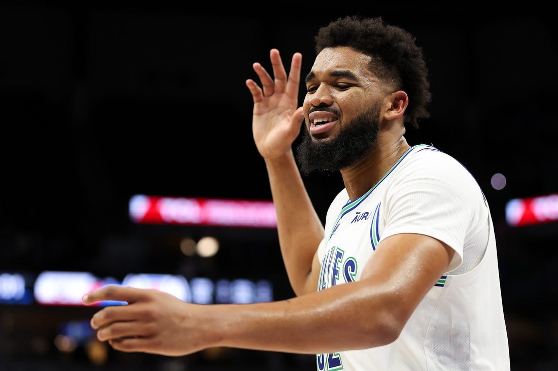 Mar 3, 2024; Minneapolis, Minnesota, USA; Minnesota Timberwolves center Karl-Anthony Towns (32) reacts after being charged with a foul against the LA Clippers during the second half at Target Center. Mandatory Credit: Matt Krohn-USA TODAY Sports