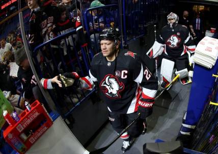 Mar 3, 2024; Buffalo, New York, USA;  Buffalo Sabres right wing Kyle Okposo (21) makes his way to the ice before a game against the Winnipeg Jets at KeyBank Center. Mandatory Credit: Timothy T. Ludwig-USA TODAY Sports