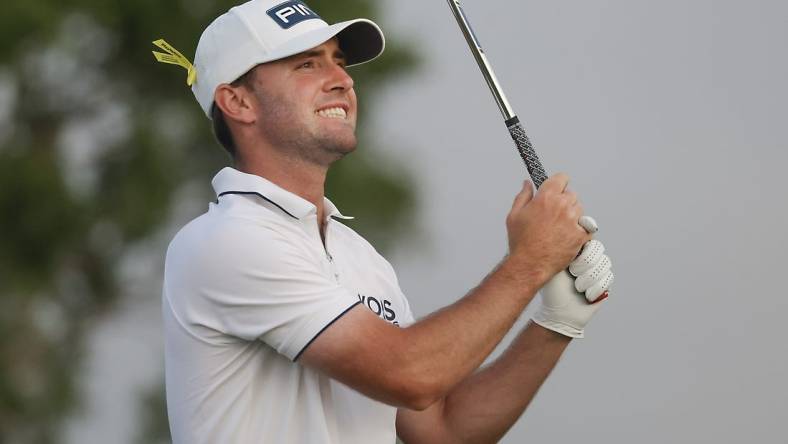 Mar 3, 2024; Palm Beach Gardens, Florida, USA;  Austin Eckroat plays his shot from the fifth tee during the final round of the Cognizant Classic in The Palm Beaches golf tournament. Mandatory Credit: Reinhold Matay-USA TODAY Sports