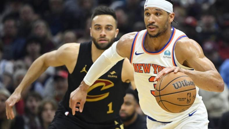 Mar 3, 2024; Cleveland, Ohio, USA; New York Knicks guard Josh Hart (3) dribbles beside Cleveland Cavaliers guard Max Strus (1) in the second quarter at Rocket Mortgage FieldHouse. Mandatory Credit: David Richard-USA TODAY Sports