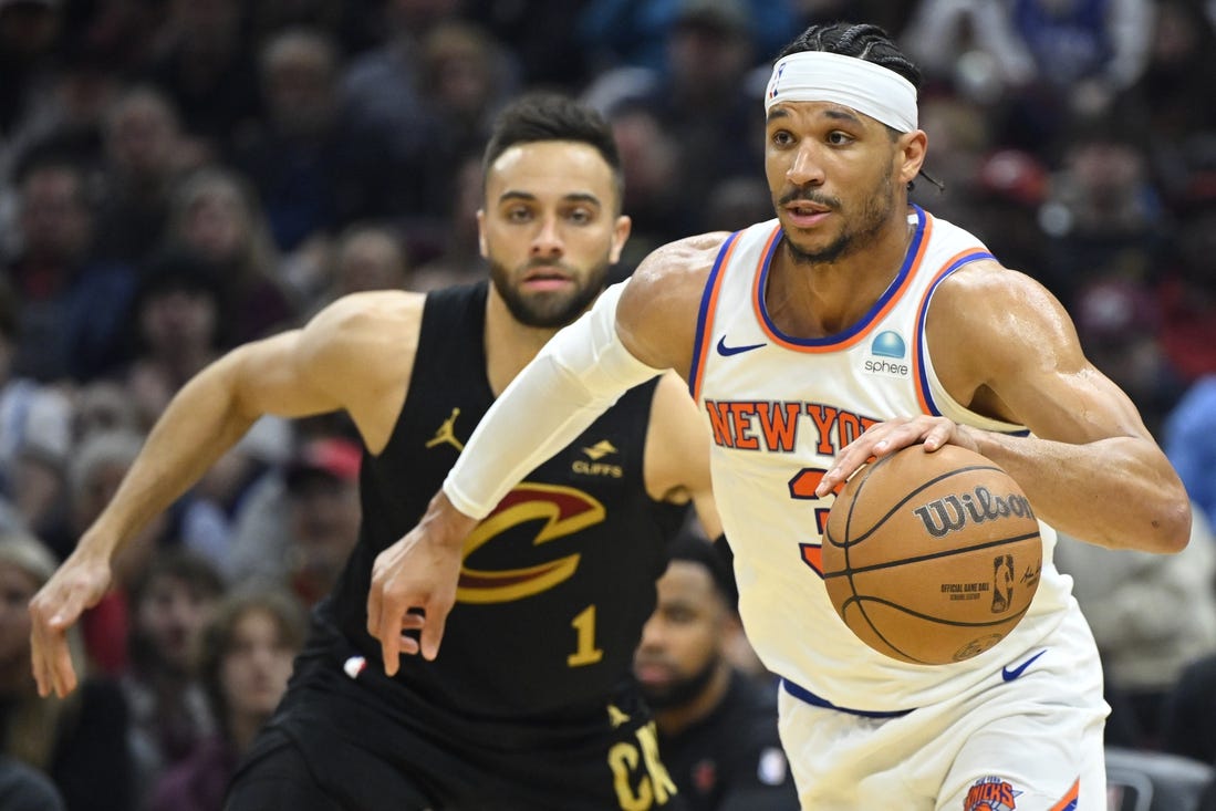 Mar 3, 2024; Cleveland, Ohio, USA; New York Knicks guard Josh Hart (3) dribbles beside Cleveland Cavaliers guard Max Strus (1) in the second quarter at Rocket Mortgage FieldHouse. Mandatory Credit: David Richard-USA TODAY Sports