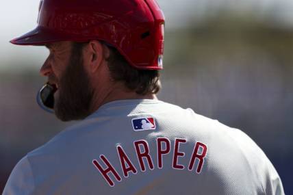Mar 4, 2024; Dunedin, Florida, USA;  Philadelphia Phillies first baseman Bryce Harper (3) looks on from the on deck circle during a game against the Toronto Blue Jays in the third inning at TD Ballpark. Mandatory Credit: Nathan Ray Seebeck-USA TODAY Sports