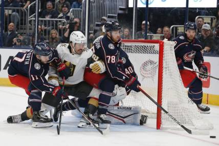 Mar 4, 2024; Columbus, Ohio, USA; Columbus Blue Jackets defenseman Damon Severson (78) clears a loose puck against the Vegas Golden Knights during the first period at Nationwide Arena. Mandatory Credit: Russell LaBounty-USA TODAY Sports