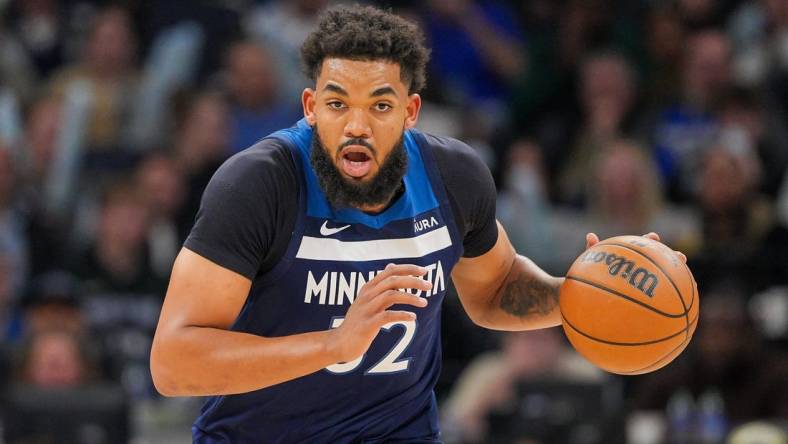 Mar 4, 2024; Minneapolis, Minnesota, USA; Minnesota Timberwolves center Karl-Anthony Towns (32) dribbles against the Portland Trail Blazers in the third quarter at Target Center. Mandatory Credit: Brad Rempel-USA TODAY Sports