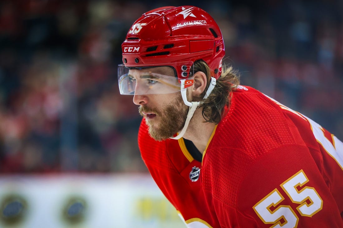 Mar 4, 2024; Calgary, Alberta, CAN; Calgary Flames defenseman Noah Hanifin (55) against the Seattle Kraken during the second period at Scotiabank Saddledome. Mandatory Credit: Sergei Belski-USA TODAY Sports