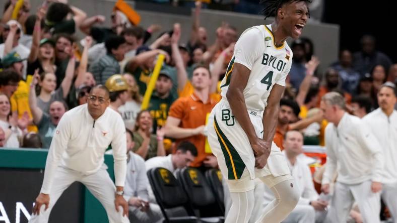 Mar 4, 2024; Waco, Texas, USA; Baylor Bears guard Ja'Kobe Walter (4) reacts after scoring a three point basket against the Texas Longhorns during the second half at Paul and Alejandra Foster Pavilion. Mandatory Credit: Chris Jones-USA TODAY Sports