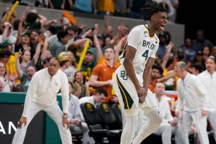Mar 4, 2024; Waco, Texas, USA; Baylor Bears guard Ja'Kobe Walter (4) reacts after scoring a three point basket against the Texas Longhorns during the second half at Paul and Alejandra Foster Pavilion. Mandatory Credit: Chris Jones-USA TODAY Sports