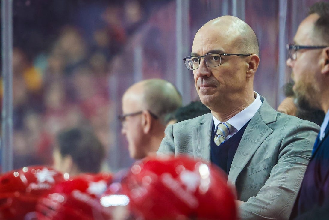 Mar 4, 2024; Calgary, Alberta, CAN; Calgary Flames head coach Ryan Huska on his bench against the Seattle Kraken during the second period at Scotiabank Saddledome. Mandatory Credit: Sergei Belski-USA TODAY Sports