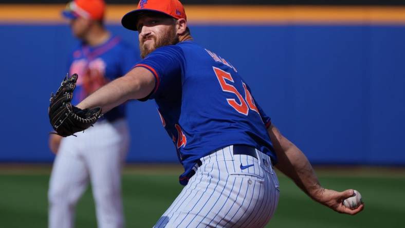 Mar 5, 2024; Port St. Lucie, Florida, USA;  New York Mets pitcher Austin Adams (54) warms-up in the seventh inning against the New York Yankees at Clover Park. Mandatory Credit: Jim Rassol-USA TODAY Sports