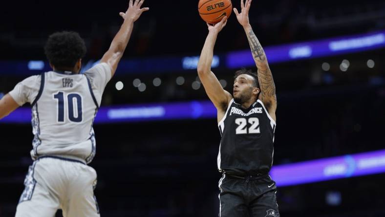 Mar 5, 2024; Washington, District of Columbia, USA;Providence Friars guard Devin Carter (22) shoots the ball as Georgetown Hoyas guard Jayden Epps (10) defends in the first half  at Capital One Arena. Mandatory Credit: Geoff Burke-USA TODAY Sports