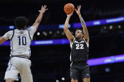 Mar 5, 2024; Washington, District of Columbia, USA;Providence Friars guard Devin Carter (22) shoots the ball as Georgetown Hoyas guard Jayden Epps (10) defends in the first half  at Capital One Arena. Mandatory Credit: Geoff Burke-USA TODAY Sports