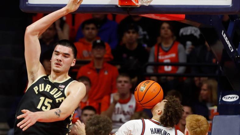 Purdue Boilermakers center Zach Edey (15) dunks the ball over Illinois Fighting Illini guard Niccolo Moretti (11), Illinois Fighting Illini forward Coleman Hawkins (33) and Illinois Fighting Illini guard Luke Goode (10) during the NCAA men   s basketball game, Tuesday, March 5, 2024, at State Farm Center in Champaign, Ill.