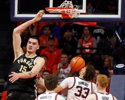 Purdue Boilermakers center Zach Edey (15) dunks the ball over Illinois Fighting Illini guard Niccolo Moretti (11), Illinois Fighting Illini forward Coleman Hawkins (33) and Illinois Fighting Illini guard Luke Goode (10) during the NCAA men   s basketball game, Tuesday, March 5, 2024, at State Farm Center in Champaign, Ill.
