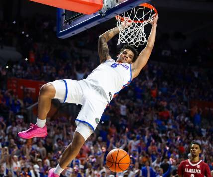 Florida Gators guard Will Richard (5) dunks the ball during the first half. The Florida men   s basketball team hosted the Alabama Crimson Tied at Exactech Arena at the Stephen C. O   Connell Center in Gainesville, FL on Tuesday, March 5, 2024. [Doug Engle/Ocala Star Banner]