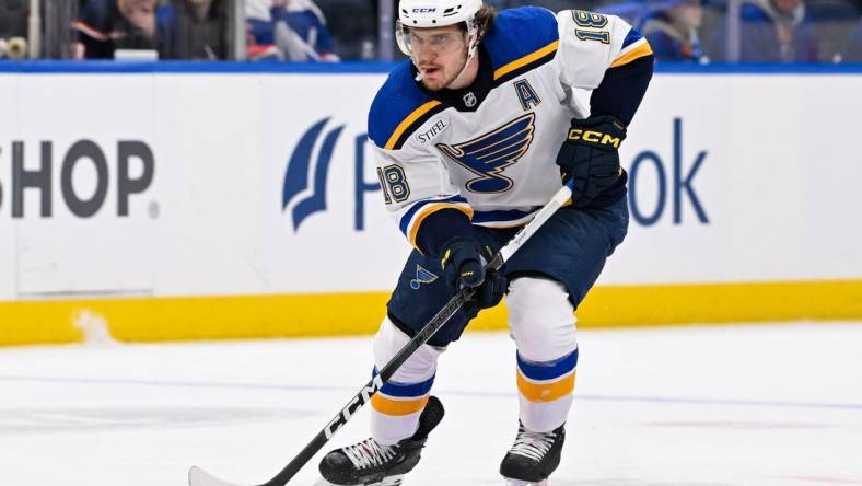 Mar 5, 2024; Elmont, New York, USA; St. Louis Blues center Robert Thomas (18) skates with puck against the New York Islanders during the first period at UBS Arena. Mandatory Credit: Dennis Schneidler-USA TODAY Sports