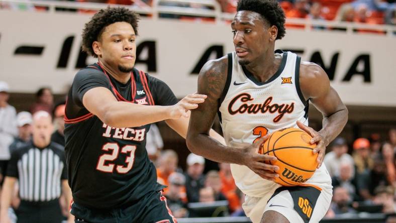 Mar 5, 2024; Stillwater, Oklahoma, USA; Oklahoma State Cowboys forward Eric Dailey Jr. (2) drives around Texas Tech Red Raiders forward Eemeli Yalaho (23) during the first half at Gallagher-Iba Arena. Mandatory Credit: William Purnell-USA TODAY Sports