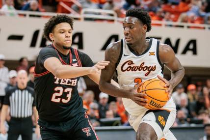 Mar 5, 2024; Stillwater, Oklahoma, USA; Oklahoma State Cowboys forward Eric Dailey Jr. (2) drives around Texas Tech Red Raiders forward Eemeli Yalaho (23) during the first half at Gallagher-Iba Arena. Mandatory Credit: William Purnell-USA TODAY Sports