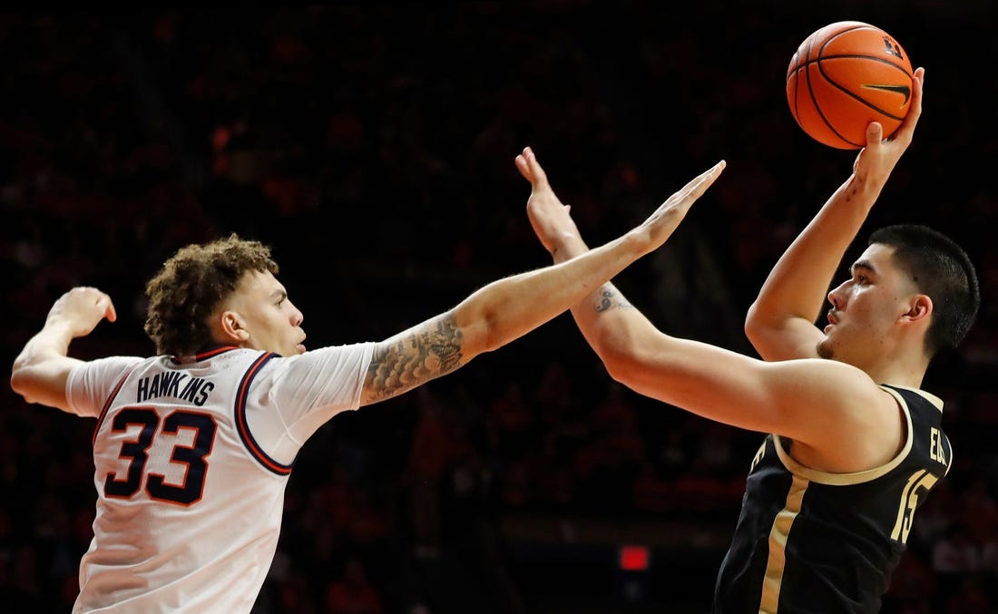 Illinois Fighting Illini forward Coleman Hawkins (33) defends the shot of Purdue Boilermakers center Zach Edey (15) during the NCAA men's basketball game, Tuesday, March 5, 2024, at State Farm Center in Champaign, Ill. Purdue Boilermakers won 77-71.