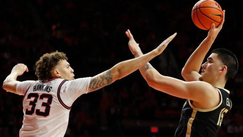 Illinois Fighting Illini forward Coleman Hawkins (33) defends the shot of Purdue Boilermakers center Zach Edey (15) during the NCAA men's basketball game, Tuesday, March 5, 2024, at State Farm Center in Champaign, Ill. Purdue Boilermakers won 77-71.