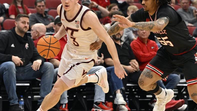 Mar 5, 2024; Louisville, Kentucky, USA; Virginia Tech Hokies guard Sean Pedulla (3) dribbles against Louisville Cardinals guard Skyy Clark (55) during the first half at KFC Yum! Center. Virginia Tech defeated Louisville 80-64. Mandatory Credit: Jamie Rhodes-USA TODAY Sports