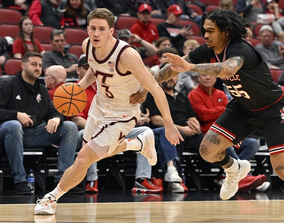 Mar 5, 2024; Louisville, Kentucky, USA; Virginia Tech Hokies guard Sean Pedulla (3) dribbles against Louisville Cardinals guard Skyy Clark (55) during the first half at KFC Yum! Center. Virginia Tech defeated Louisville 80-64. Mandatory Credit: Jamie Rhodes-USA TODAY Sports