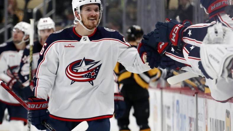 Mar 5, 2024; Pittsburgh, Pennsylvania, USA; Columbus Blue Jackets center Jack Roslovic (96) celebrates with the Blue Jackets bench after scoring a goal against the Pittsburgh Penguins during the third period at PPG Paints Arena. The Penguins won 5-3. Mandatory Credit: Charles LeClaire-USA TODAY Sports