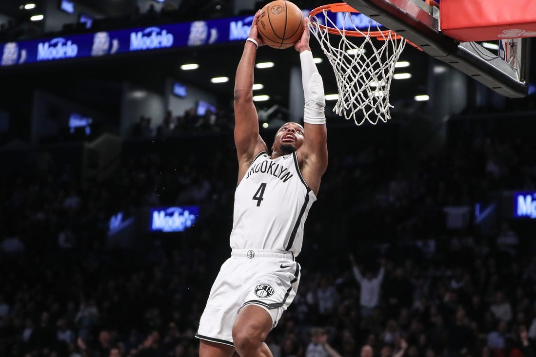 Mar 5, 2024; Brooklyn, New York, USA;  Brooklyn Nets guard Dennis Smith Jr. (4) goes up for a dunk in the fourth quarter against the Philadelphia 76ers at Barclays Center. Mandatory Credit: Wendell Cruz-USA TODAY Sports