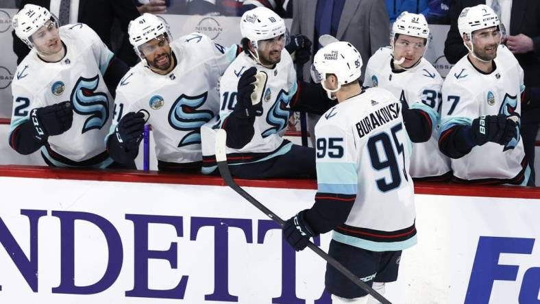 Mar 5, 2024; Winnipeg, Manitoba, CAN; Seattle Kraken left wing Andre Burakovsky (95) celebrates his third period goal against the Winnipeg Jets at Canada Life Centre. Mandatory Credit: James Carey Lauder-USA TODAY Sports