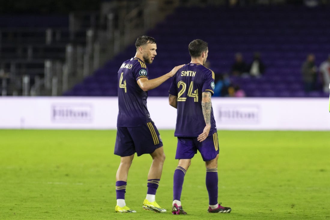 Mar 5, 2024; Orlando, FL, USA; Orlando City defender David Brekalo (4) and defender Kyle Smith (24) after the game against Tigres UNAL at INTER& CO Stadium. Mandatory Credit: Morgan Tencza-USA TODAY Sports