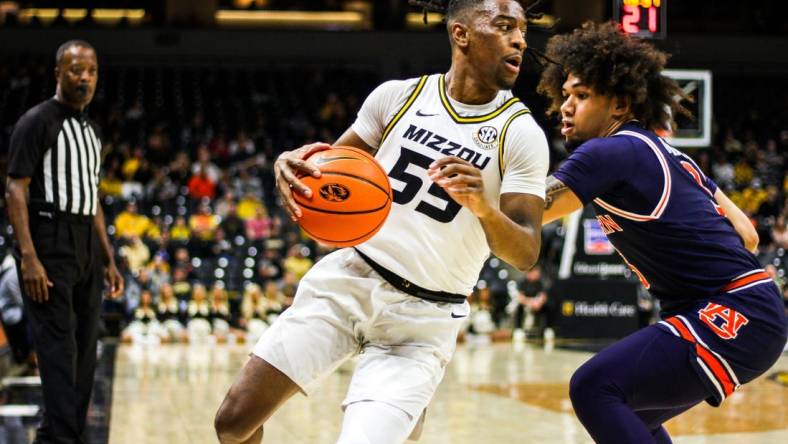 Mizzou men's basketball guard Sean East II attempts to get past an Auburn defender Tuesday at Mizzou Arena in Columbia