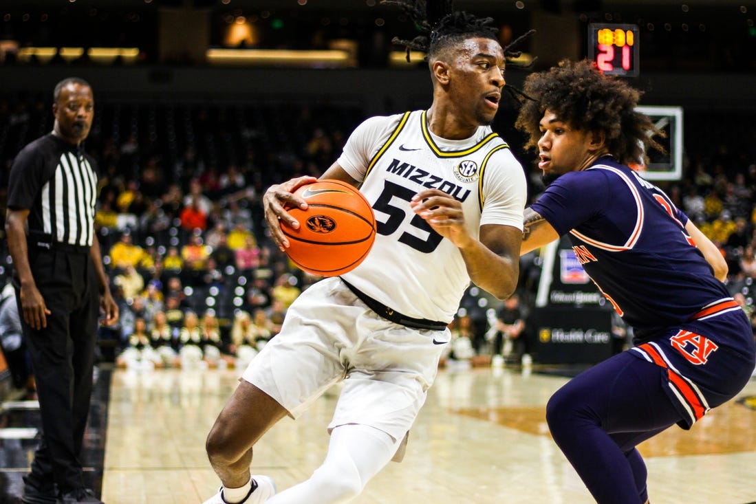 Mizzou men's basketball guard Sean East II attempts to get past an Auburn defender Tuesday at Mizzou Arena in Columbia