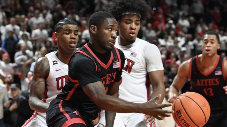 Mar 5, 2024; Las Vegas, Nevada, USA; San Diego State Aztecs guard Darrion Trammell (12) passes the ball against the UNLV Rebels in the second half at Thomas & Mack Center. Mandatory Credit: Candice Ward-USA TODAY Sports