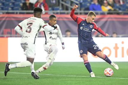 Mar 6, 2024; Foxborough, MA, USA; New England Revolution midfielder Noel Buck (29) takes a shot against Liga Deportiva Alajuelense during the second half of a match at Gillette Stadium. Mandatory Credit: Brian Fluharty-USA TODAY Sports