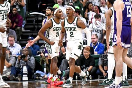 Michigan State's Tyson Walker, right, and Tre Holloman celebrate a Northwestern turnover during the second half on Wednesday, March 6, 2024, at the Breslin Center in East Lansing.
