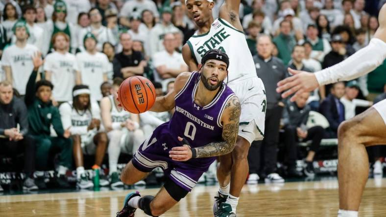 Michigan State guard Tyson Walker (2) defends Northwestern guard Boo Buie (0) during the first half at Breslin Center in East Lansing on Wednesday, March 6, 2024.