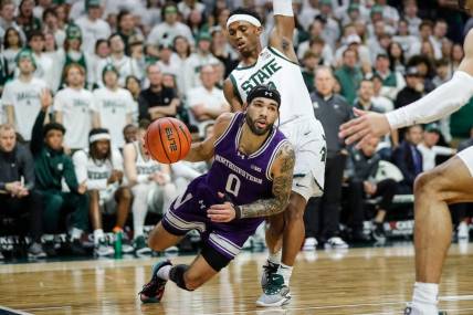 Michigan State guard Tyson Walker (2) defends Northwestern guard Boo Buie (0) during the first half at Breslin Center in East Lansing on Wednesday, March 6, 2024.