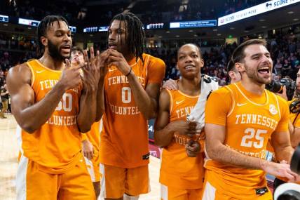 Mar 6, 2024; Columbia, South Carolina, USA; Tennessee Volunteers guard Josiah-Jordan James (30), forward Jonas Aidoo (0), guard Jordan Gainey (2) and guard Santiago Vescovi (25) celebrate following their win against the South Carolina Gamecocks at Colonial Life Arena. Mandatory Credit: Jeff Blake-USA TODAY Sports