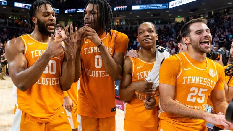 Mar 6, 2024; Columbia, South Carolina, USA; Tennessee Volunteers guard Josiah-Jordan James (30), forward Jonas Aidoo (0), guard Jordan Gainey (2) and guard Santiago Vescovi (25) celebrate following their win against the South Carolina Gamecocks at Colonial Life Arena. Mandatory Credit: Jeff Blake-USA TODAY Sports