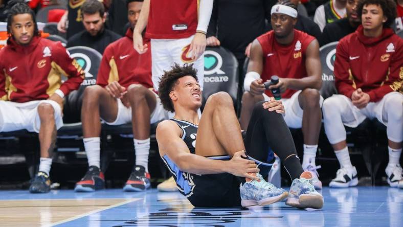 Mar 6, 2024; Atlanta, Georgia, USA; Atlanta Hawks forward Jalen Johnson (1) reacts after an ankle injury against the Cleveland Cavaliers in the second half at State Farm Arena. Mandatory Credit: Brett Davis-USA TODAY Sports
