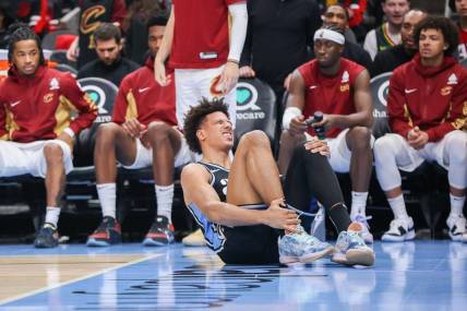 Mar 6, 2024; Atlanta, Georgia, USA; Atlanta Hawks forward Jalen Johnson (1) reacts after an ankle injury against the Cleveland Cavaliers in the second half at State Farm Arena. Mandatory Credit: Brett Davis-USA TODAY Sports