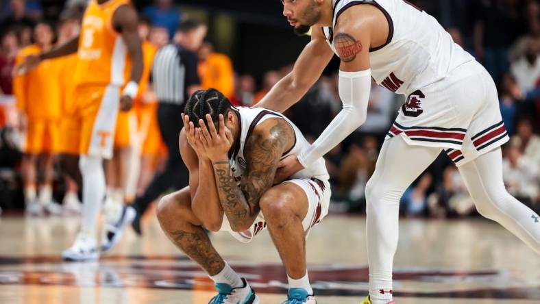 Mar 6, 2024; Columbia, South Carolina, USA; South Carolina Gamecocks guard Jacobi Wright (1) consoles guard Ta’Lon Cooper (55) in the closing moments of their loss to the Tennessee Volunteers in the second half at Colonial Life Arena. Mandatory Credit: Jeff Blake-USA TODAY Sports