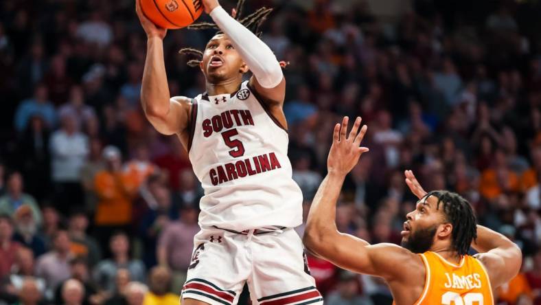 Mar 6, 2024; Columbia, South Carolina, USA; South Carolina Gamecocks guard Meechie Johnson (5) drives past Tennessee Volunteers guard Josiah-Jordan James (30) in the second half at Colonial Life Arena. Mandatory Credit: Jeff Blake-USA TODAY Sports