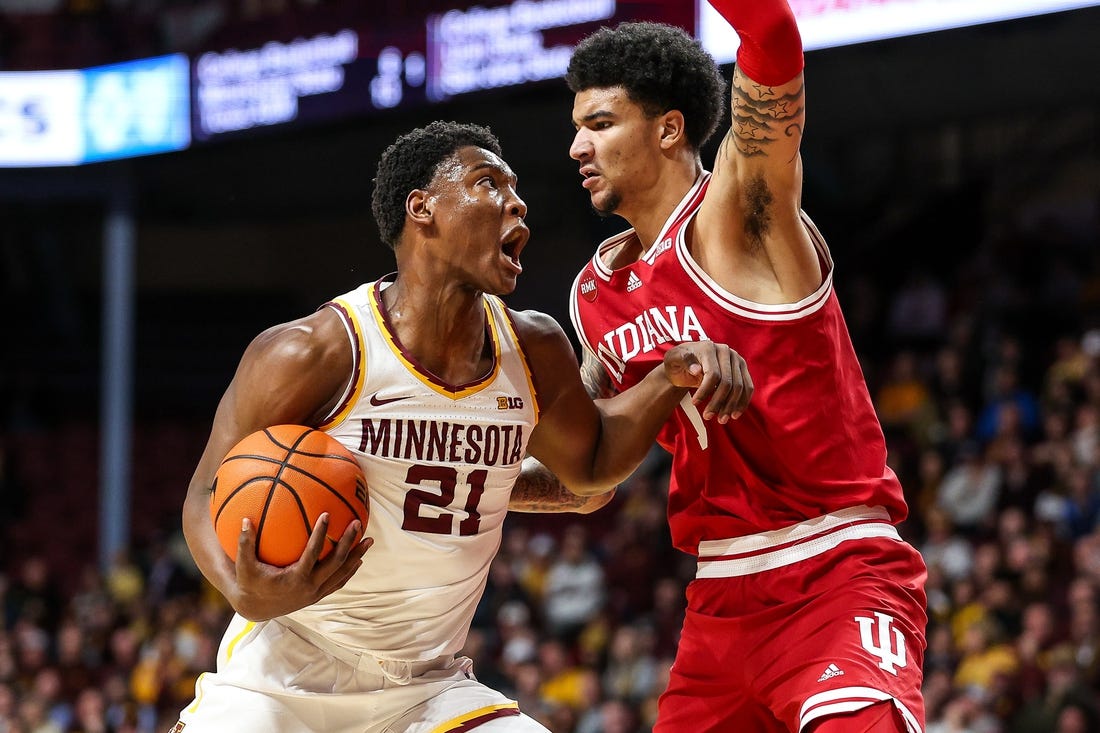 Mar 6, 2024; Minneapolis, Minnesota, USA; Minnesota Golden Gophers forward Pharrel Payne (21) works around Indiana Hoosiers center Kel'el Ware (1)  during the first half at Williams Arena. Mandatory Credit: Matt Krohn-USA TODAY Sports