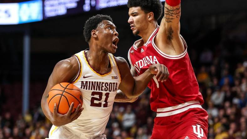 Mar 6, 2024; Minneapolis, Minnesota, USA; Minnesota Golden Gophers forward Pharrel Payne (21) works around Indiana Hoosiers center Kel'el Ware (1)  during the first half at Williams Arena. Mandatory Credit: Matt Krohn-USA TODAY Sports