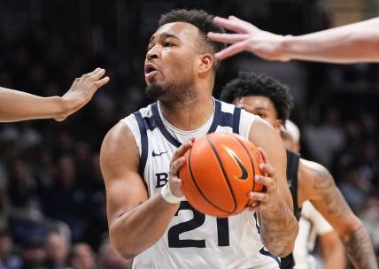 Butler Bulldogs guard Pierre Brooks II (21) searches to pass the ball Wednesday, March 6, 2024, during the game at Hinkle Fieldhouse in Indianapolis. The Butler Bulldogs defeated the Xavier Musketeers, 72-66.