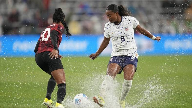 Mar 6, 2024; San Diego, California, USA;  USA forward Jaedyn Shaw (8) dribbles the ball against Canada defender Ashley Lawrence (10) during the first half of the 2024 Concacaf W Gold Cup semifinal match at Snapdragon Stadium. Mandatory Credit: Ray Acevedo-USA TODAY Sports