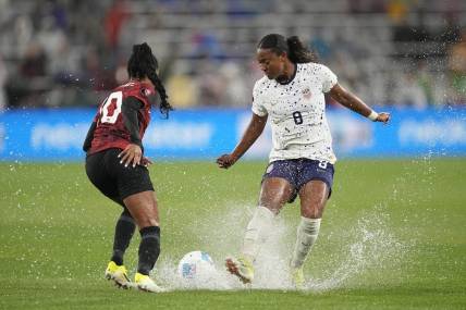 Mar 6, 2024; San Diego, California, USA;  USA forward Jaedyn Shaw (8) dribbles the ball against Canada defender Ashley Lawrence (10) during the first half of the 2024 Concacaf W Gold Cup semifinal match at Snapdragon Stadium. Mandatory Credit: Ray Acevedo-USA TODAY Sports