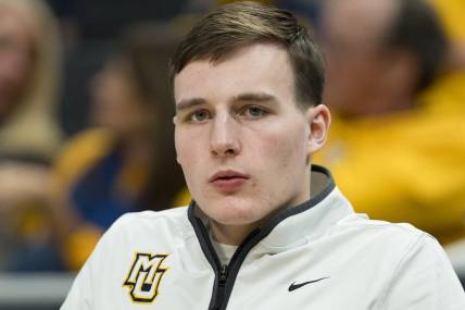 Mar 6, 2024; Milwaukee, Wisconsin, USA;  Marquette Golden Eagles guard Tyler Kolek looks on from the bench during the second half against the Connecticut Huskies at Fiserv Forum. Mandatory Credit: Jeff Hanisch-USA TODAY Sports