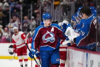Mar 6, 2024; Denver, Colorado, USA; Colorado Avalanche defenseman Cale Makar (8) celebrates his goal in the first period against the Detroit Red Wings at Ball Arena. Mandatory Credit: Ron Chenoy-USA TODAY Sports
